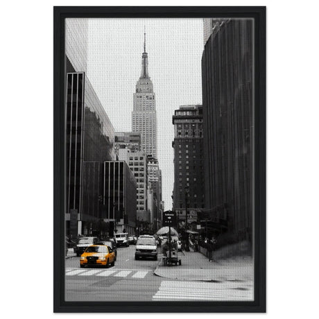 Manhattan Moments - Empire State Tower and Yellow Cab - Framed Canvas - 40x60 cm / 16x24″ - Black frame